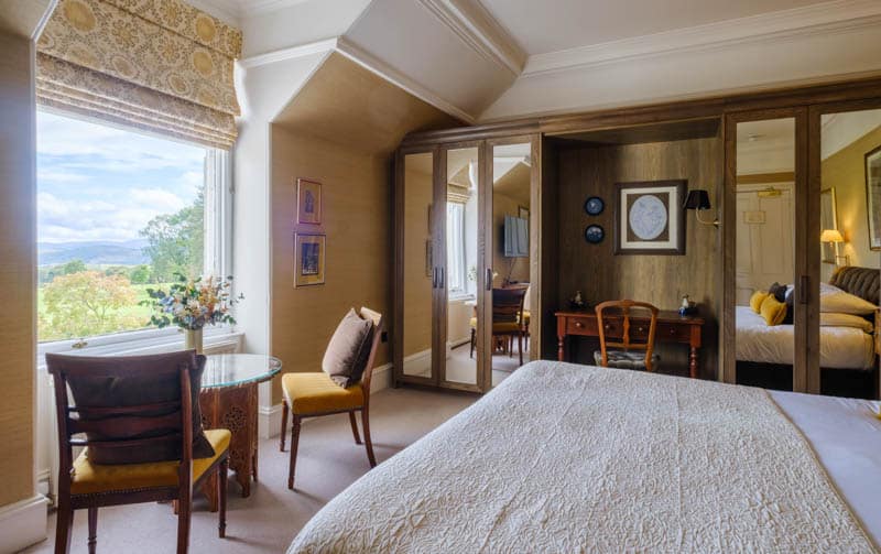 Entrance and seating area inside a Douneside House Deluxe room