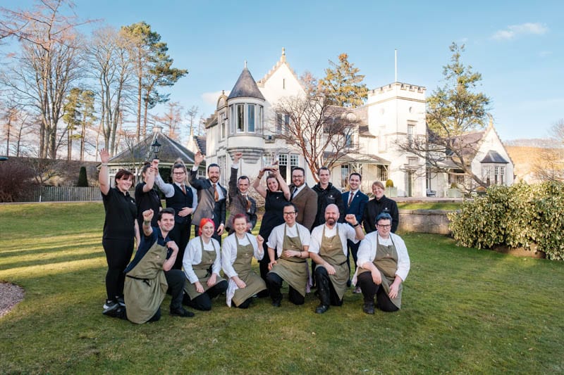 Members of the Douneside House team gathered outside the hotel