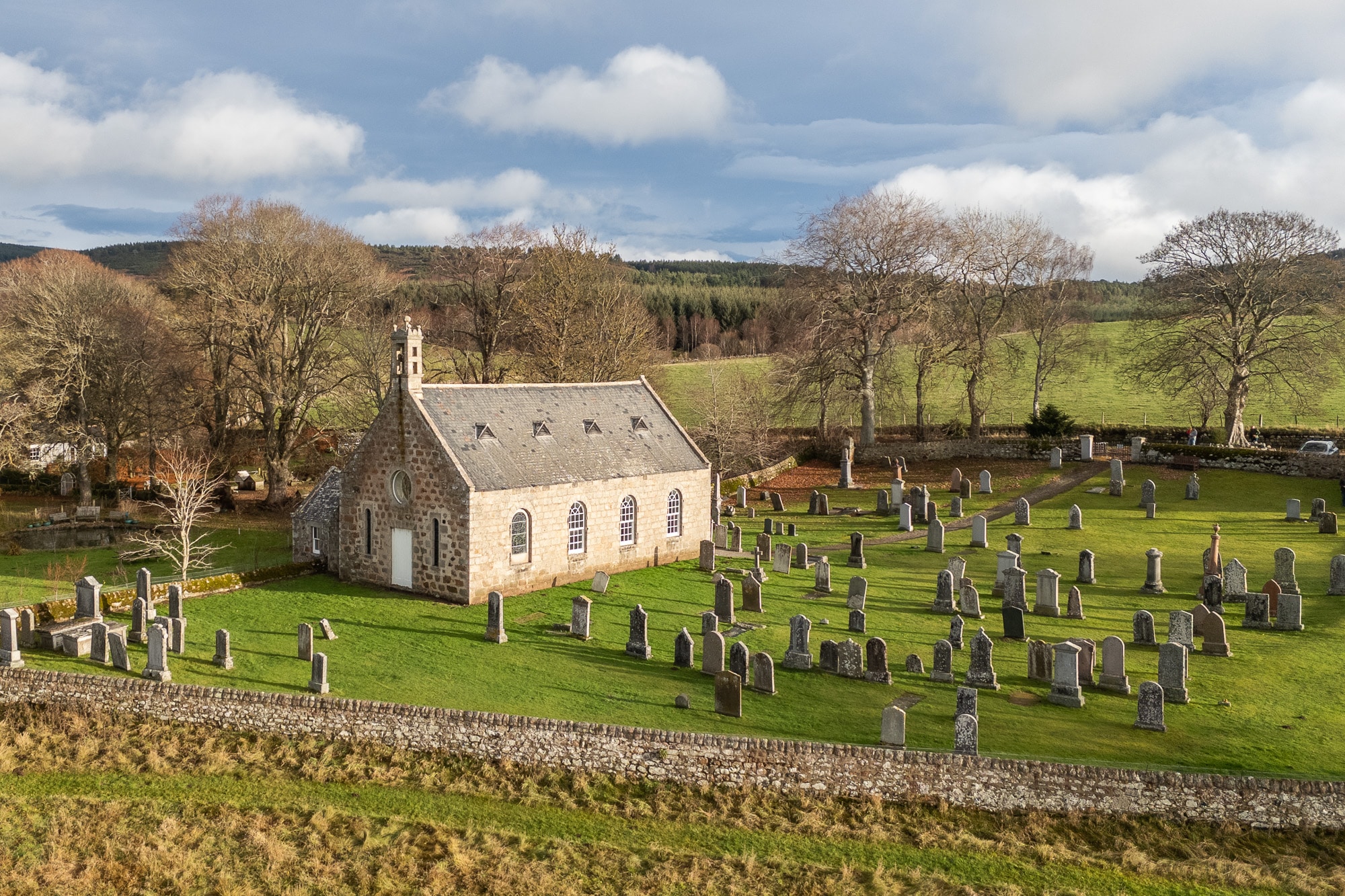 Aerial view of Coull Kirk and its surrounding graveyard in Aberdeenshire