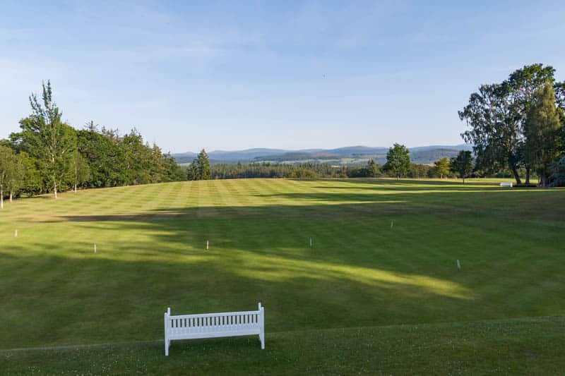 Manicured infinity lawn overlooking the Royal Deeside countryside at Douneside House