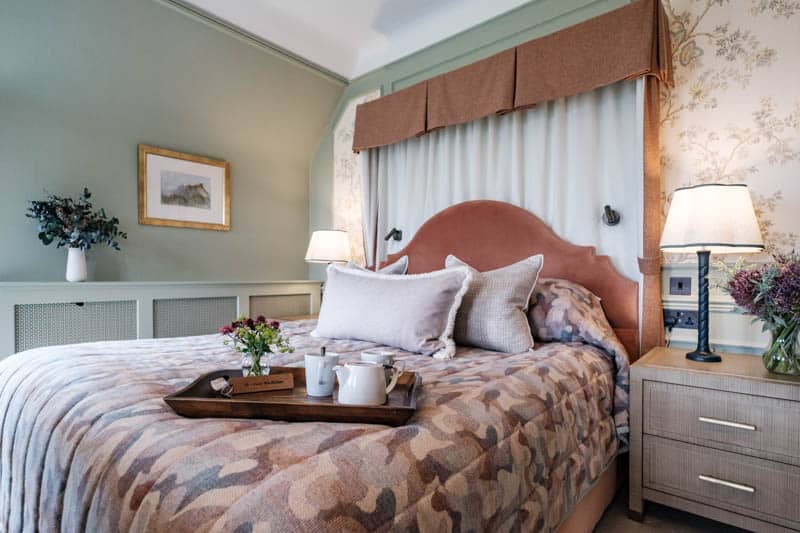 Douneside House Deluxe Bedroom Deluxe bedroom with an upholstered headboard and garden view at Douneside House