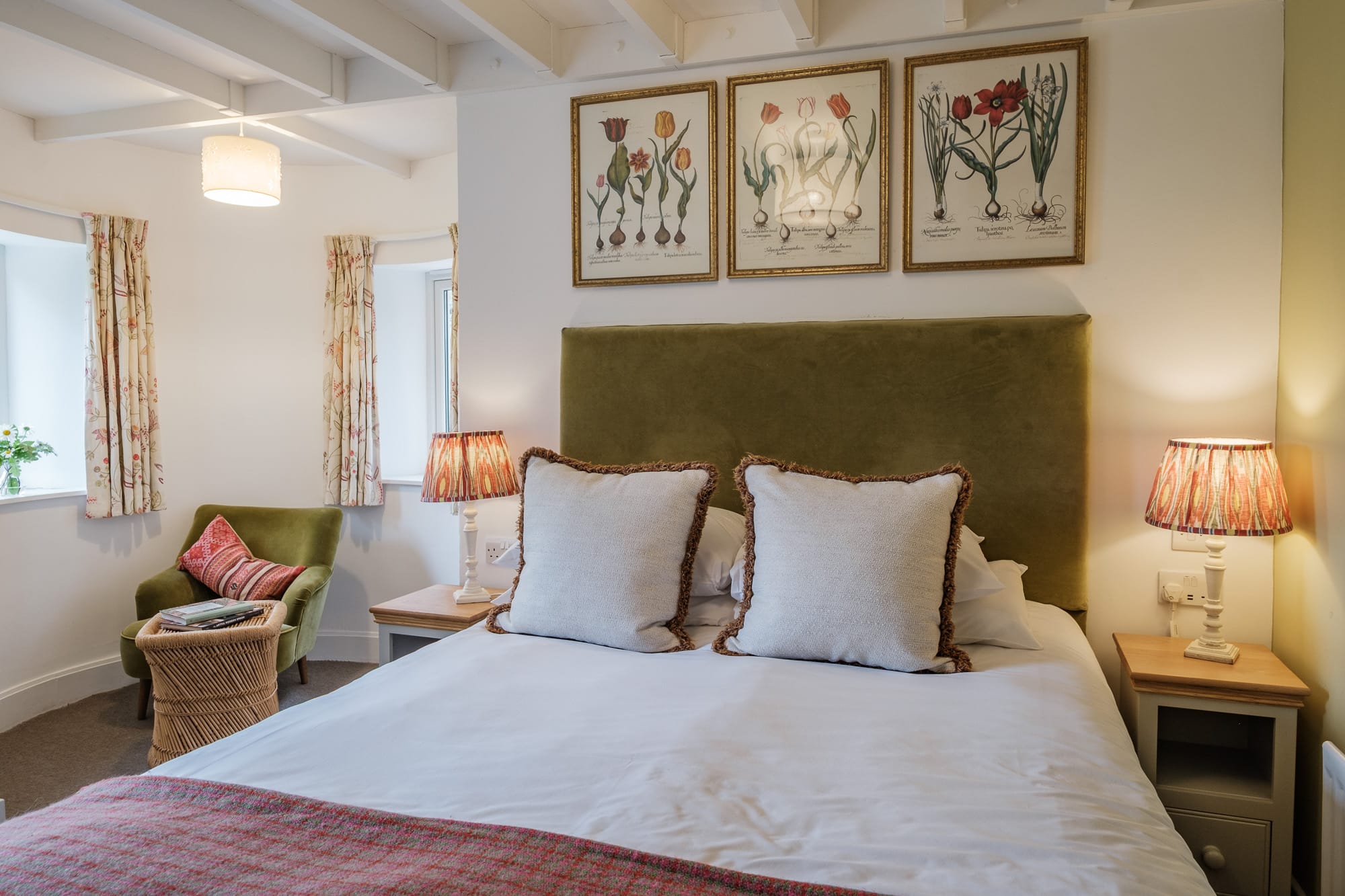 Double_Bedroom_Casa_21 Double bedroom in Casa 21 with velvet headboard, framed tulip prints and beamed ceiling at Douneside House