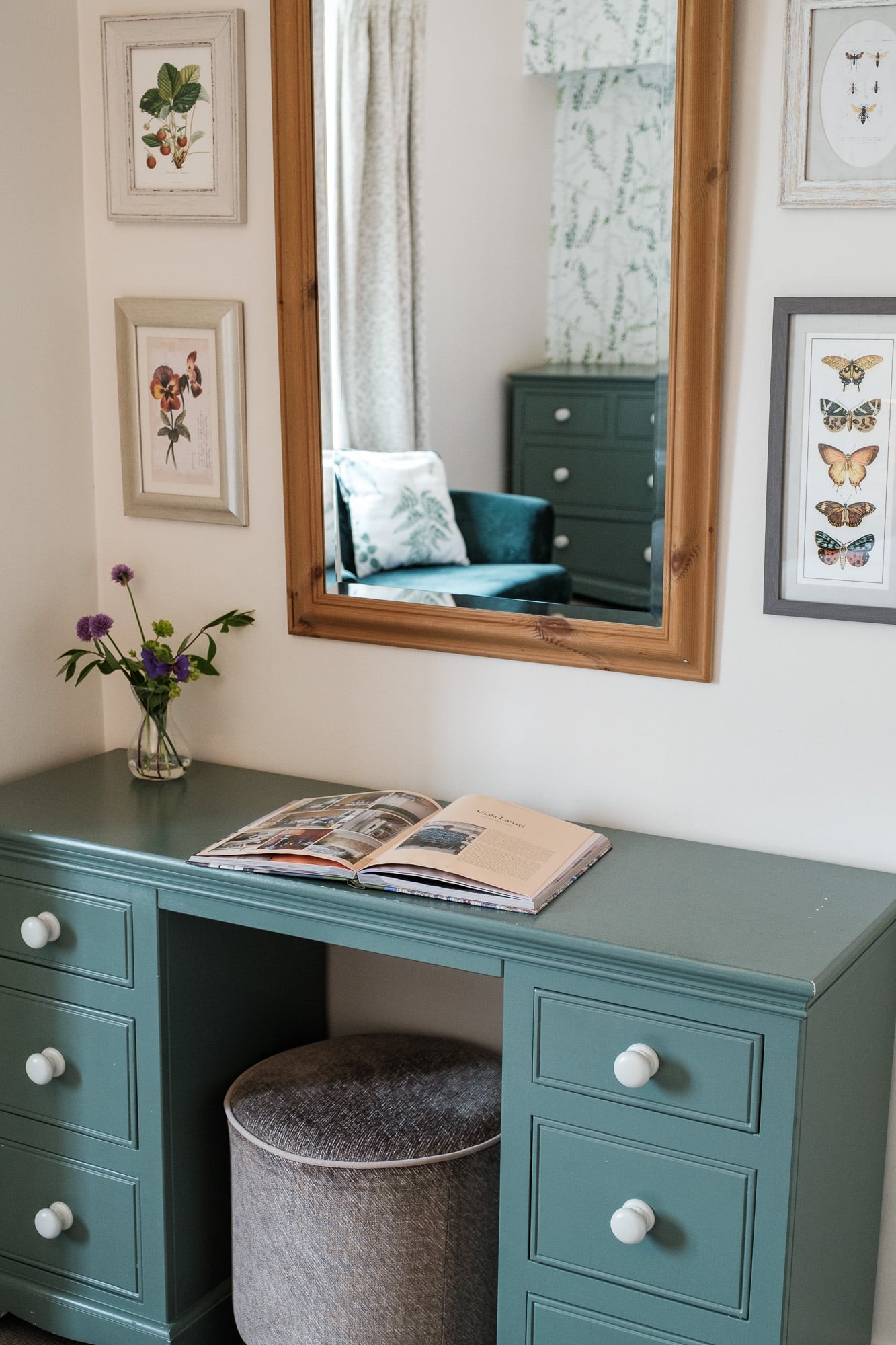 Dresser_Alpha_Cottage.jpg. Alpha Cottage dressing table in teal with framed botanical prints and mirror at Douneside House