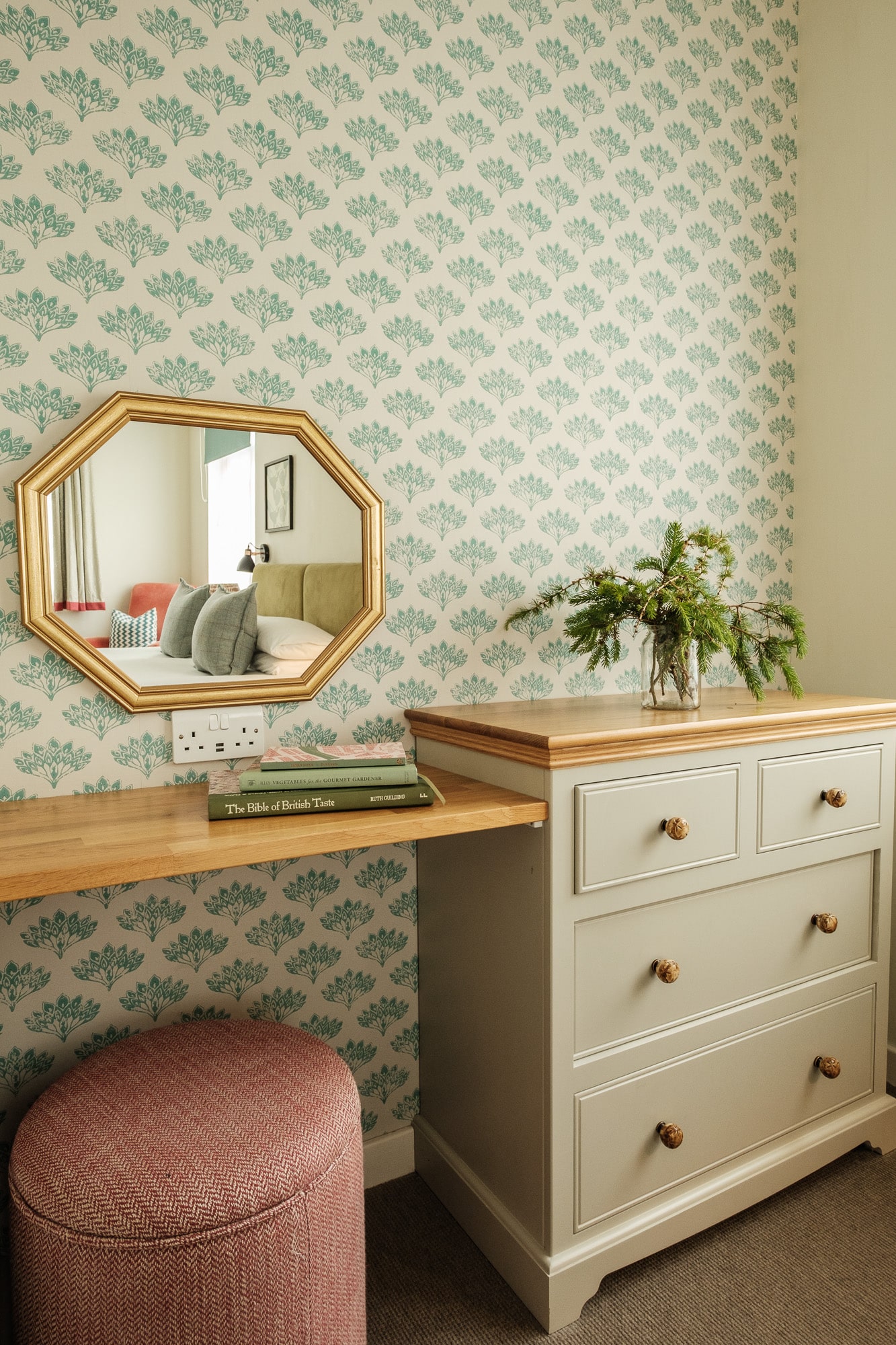 Morven Cottage dressing area with octagonal gold mirror, oak console and teal patterned wallpaper at Douneside House