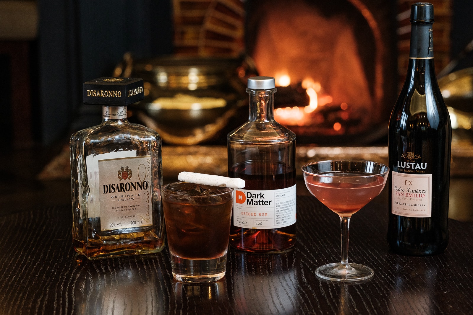 Drinks setup in front of fire in The Macrobert Reply Bar A collection of cocktails and drinks in front of the fire in The MacRobert Reply bar