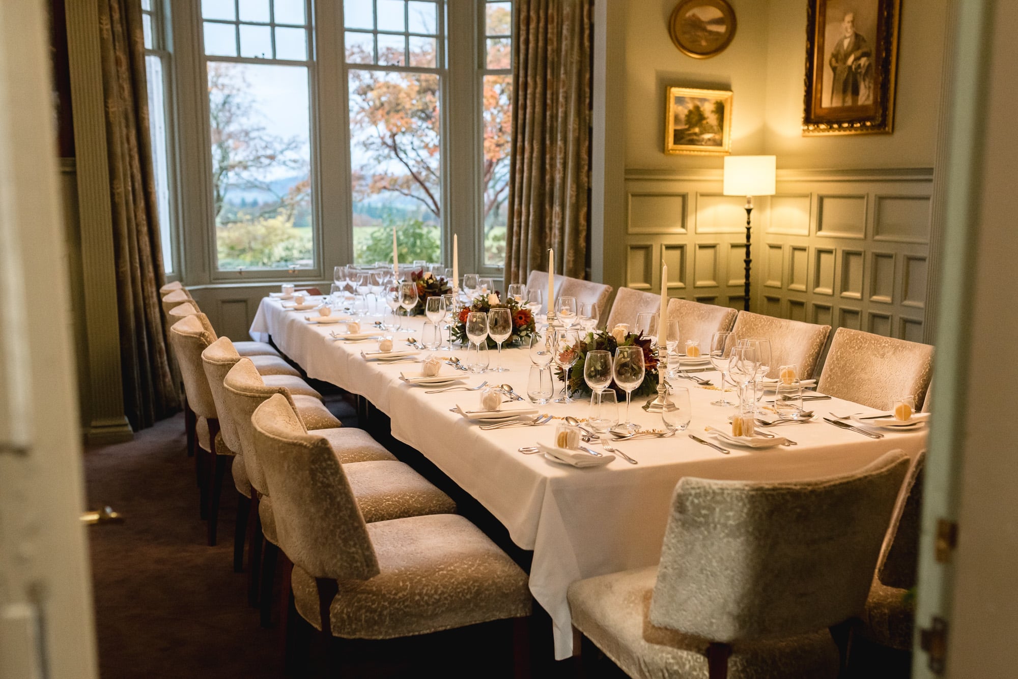 An intimate wedding dining setup in the Library at Douneside House