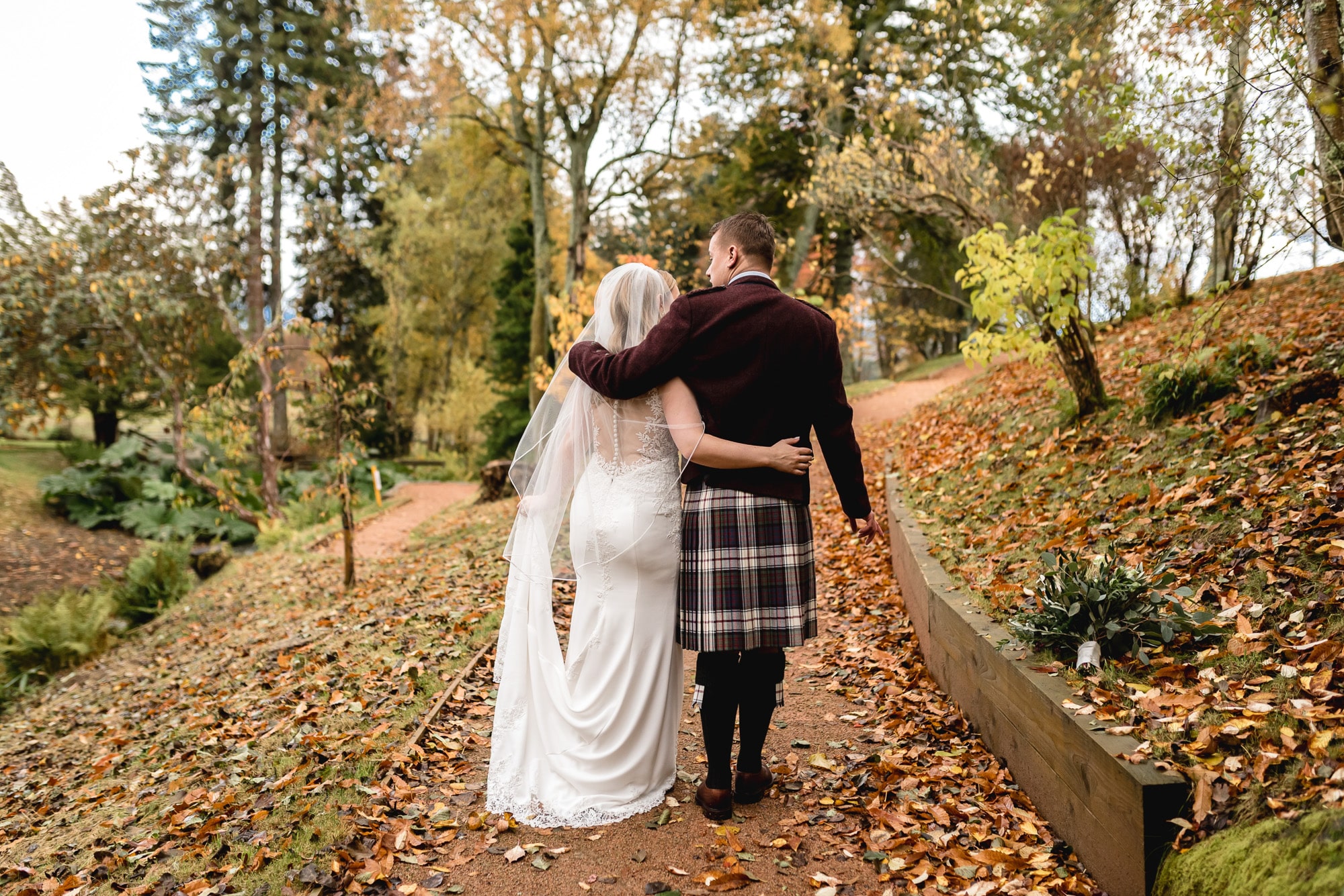 An elopement wedding couple walking the grounds of Douneside House