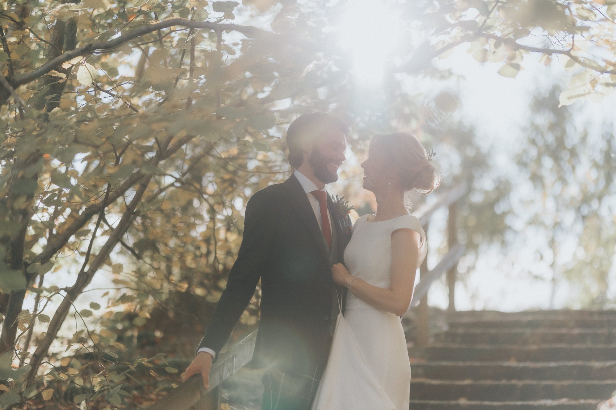 Douneside House intimate wedding photography in the gardens with sunlight through the trees
