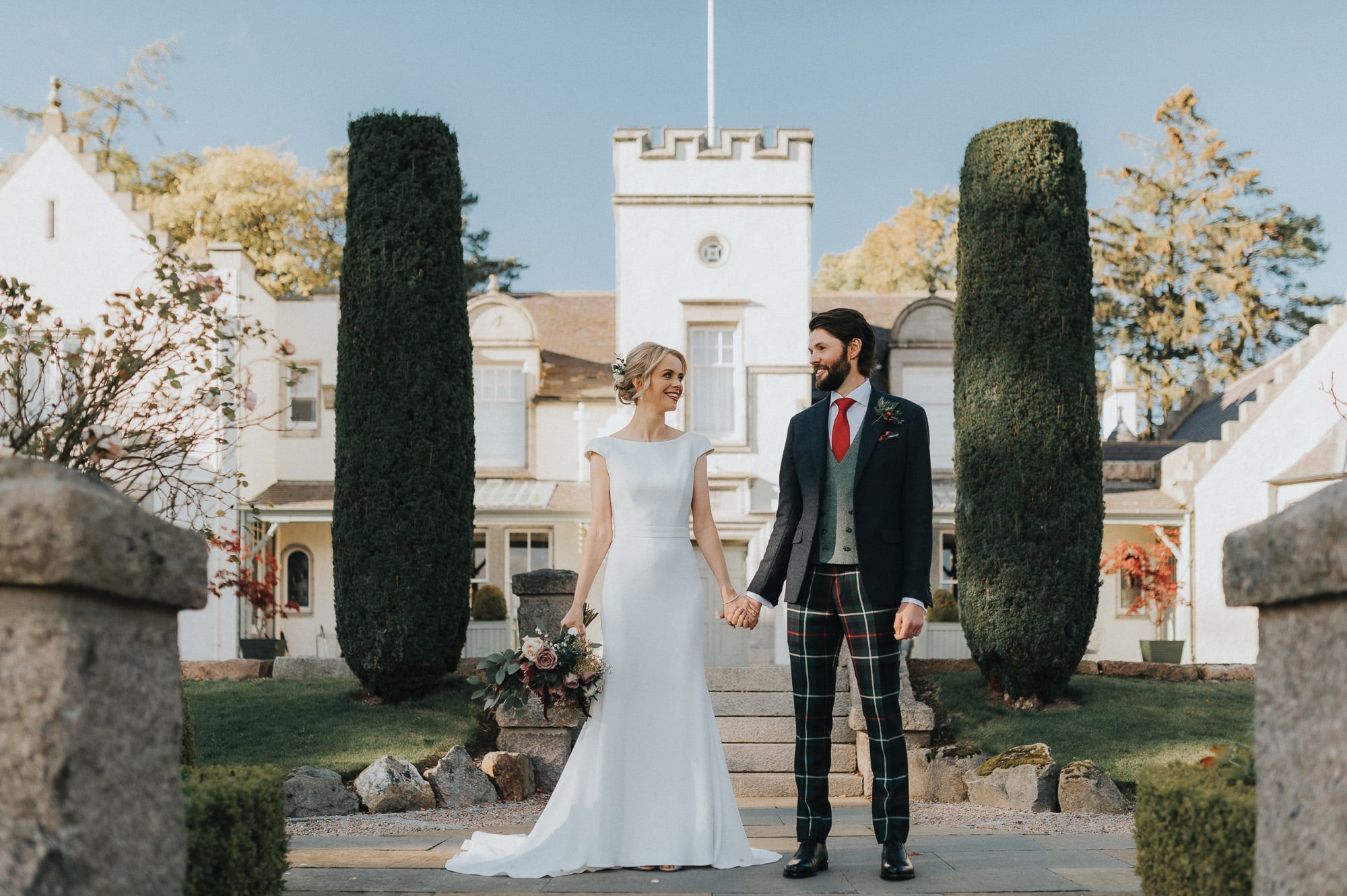 A bride and groom in front of Douneside house wedding photography