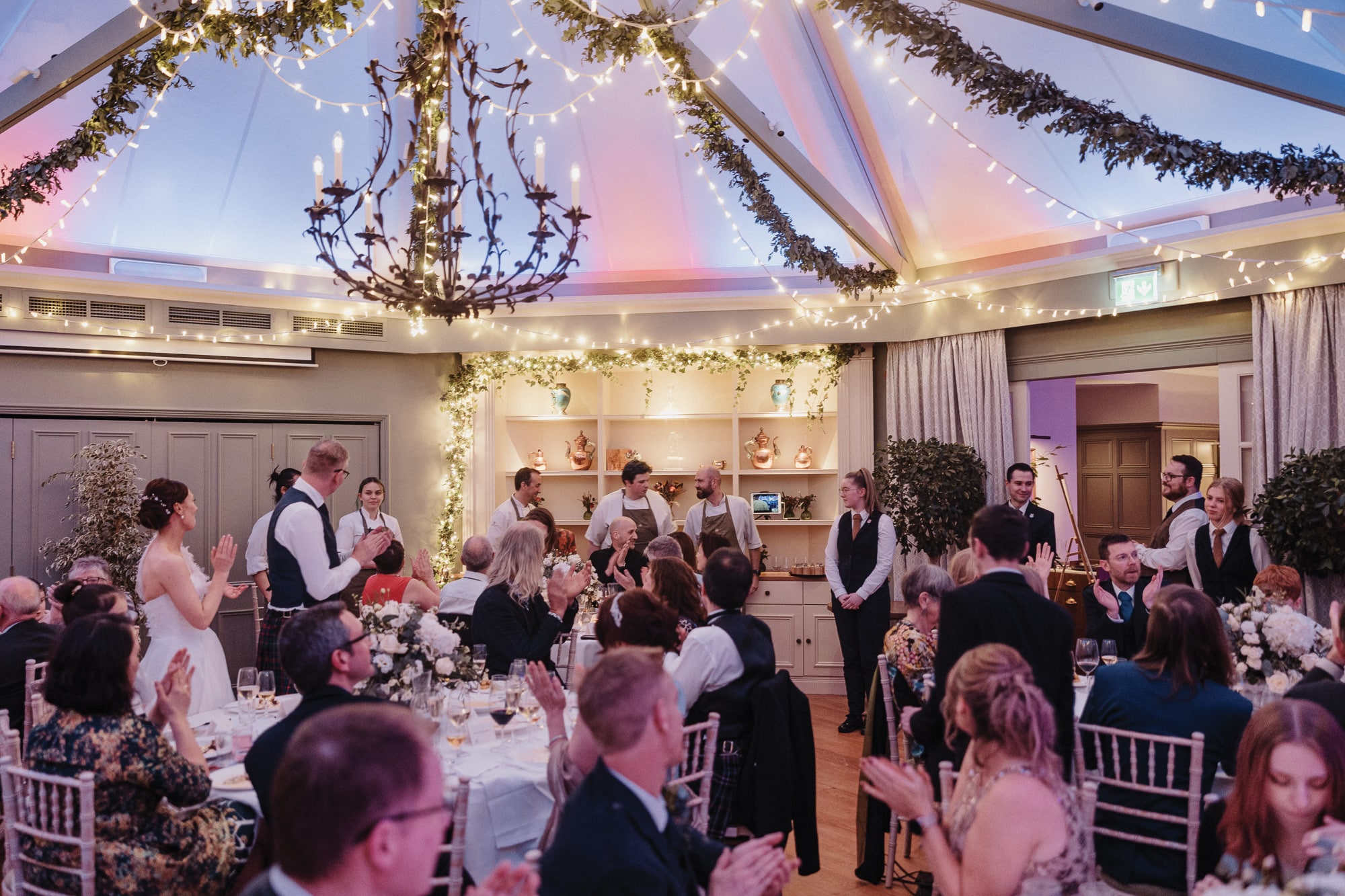 Wedding meal celebration Douneside House Couples celebrating the chefs at a wedding meal at Douneside House conservatory restaurant