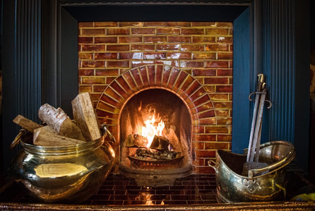 Roaring fire in the Macrobert's Reply Bar at Douneside House